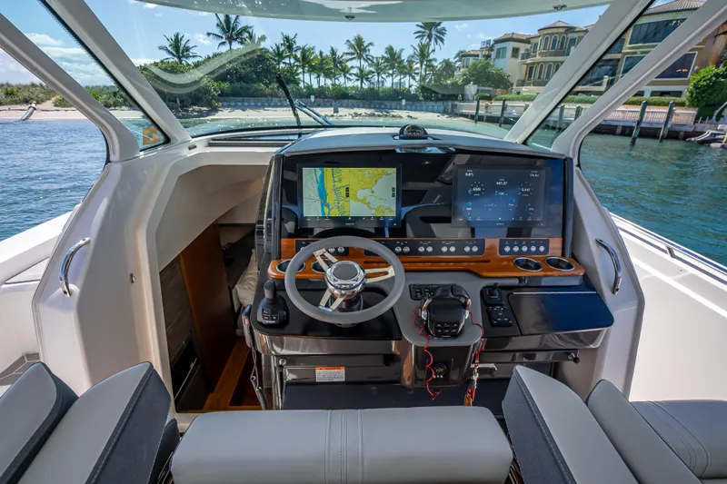 Yacht Photos Pics 2019 Tiara Sport 38 LS boat helm with advanced navigation displays and luxurious seating.