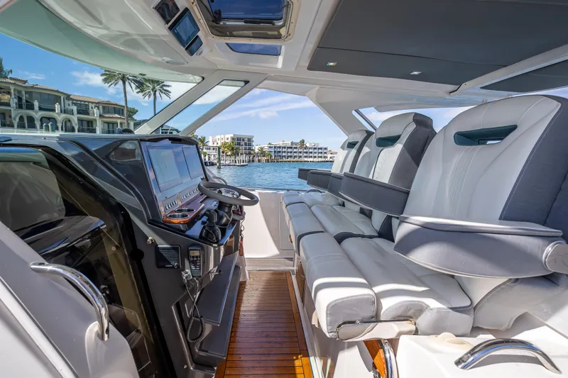  Yacht Photos Pics 2019 Tiara Sport 38 LS yacht interior with luxurious seating and modern dashboard.