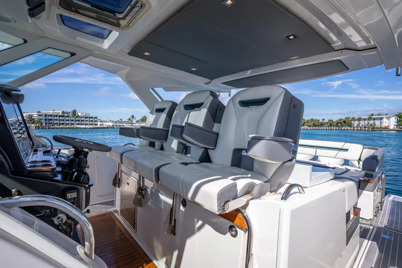  Yacht Photos Pics 2019 Tiara Sport 38 LS luxury yacht interior with plush seating and modern controls.