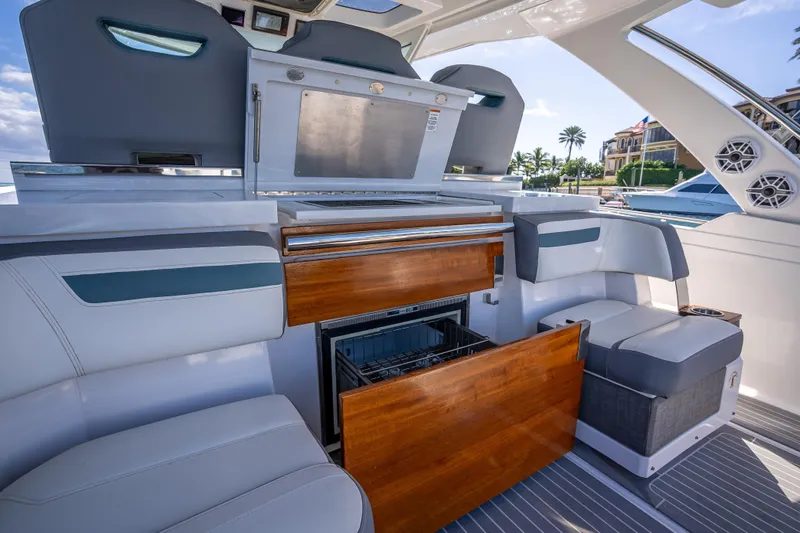  Yacht Photos Pics 2019 Tiara Sport 38 LS yacht interior with luxurious seating and built-in amenities.
