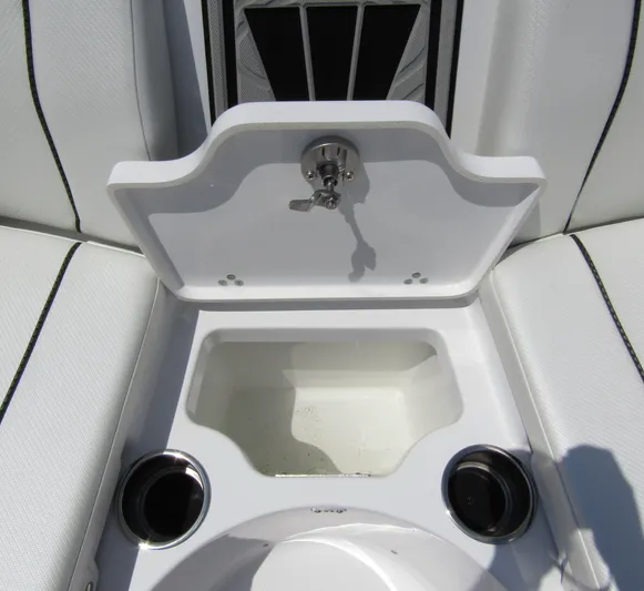  Yacht Photos Pics 2024 Wellcraft 243 Fisherman boat interior with open storage compartment and cup holders.