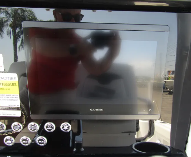  Yacht Photos Pics Garmin display on 2024 Wellcraft 243 Fisherman boat dashboard with control buttons.