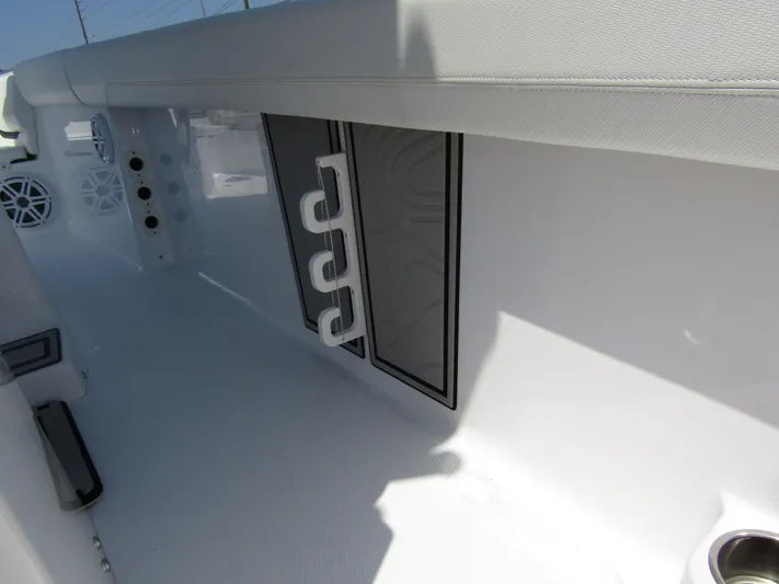  Yacht Photos Pics 2024 Wellcraft 243 Fisherman boat interior with rod holders and storage compartments.