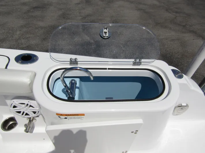  Yacht Photos Pics 2024 Wellcraft 243 Fisherman boat livewell with open lid and faucet.