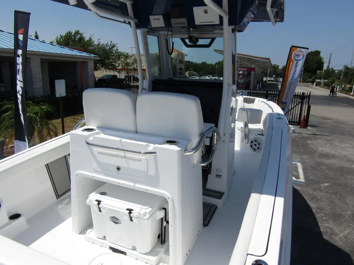  Yacht Photos Pics 2024 Wellcraft 243 Fisherman boat interior with seating and storage.