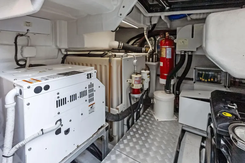 La Ruta Yacht Photos Pics Engine room of a 2017 Riva Rivamare yacht with equipment and fire extinguisher.