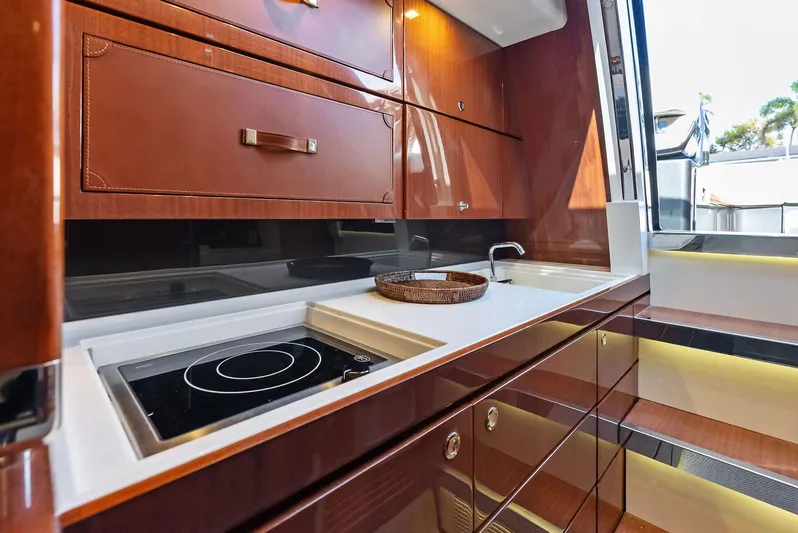 La Ruta Yacht Photos Pics 2017 Riva Rivamare yacht kitchen with modern appliances and wooden cabinetry.
