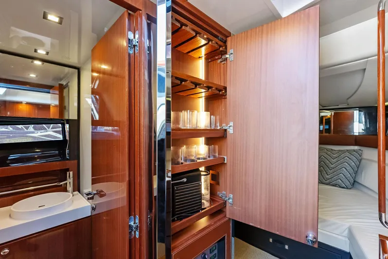 La Ruta Yacht Photos Pics Luxurious interior of 2017 Riva Rivamare yacht with wooden cabinets and modern amenities.