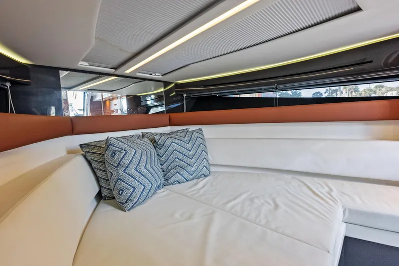 La Ruta Yacht Photos Pics Interior of 2017 Riva Rivamare yacht with white seating and patterned cushions.