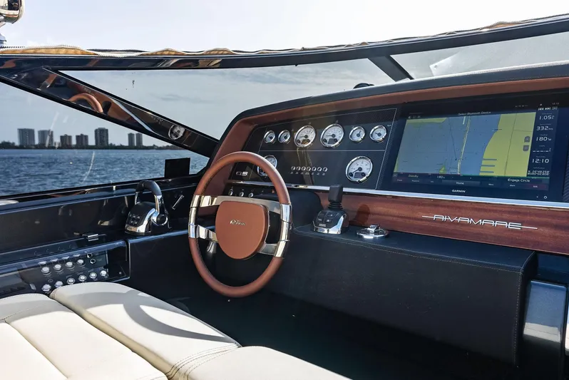 La Ruta Yacht Photos Pics Interior cockpit of 2017 Riva Rivamare yacht with navigation system and leather steering wheel.