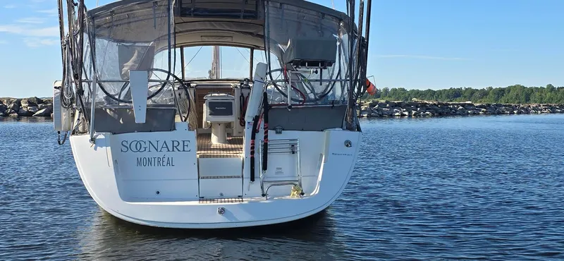 Sognare Yacht Photos Pics Beneteau Oceanis 40 sailboat, 2011 model, named "Sognare," docked in calm waters.