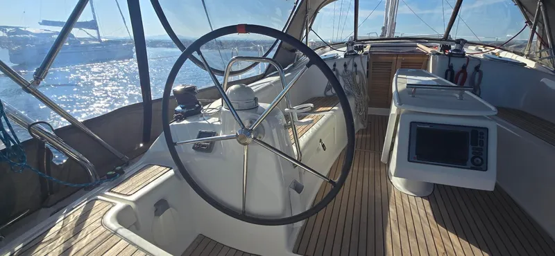 Sognare Yacht Photos Pics 2011 Beneteau Oceanis 40 yacht cockpit with steering wheel and navigation equipment.
