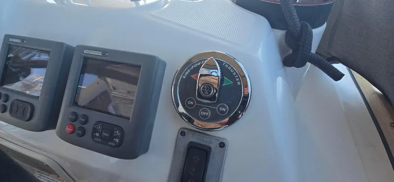 Sognare Yacht Photos Pics Control panel of a 2011 Beneteau Oceanis 40 sailboat, featuring navigation instruments and bow thruster controls.