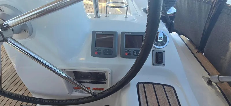 Sognare Yacht Photos Pics Steering wheel and control panel of 2011 Beneteau Oceanis 40 sailboat cockpit.