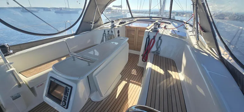 Sognare Yacht Photos Pics Beneteau Oceanis 40 cockpit, 2011 model, featuring teak flooring and navigation equipment.