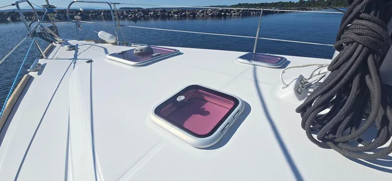 Sognare Yacht Photos Pics Deck of 2011 Beneteau Oceanis 40 sailboat with hatches and coiled ropes.