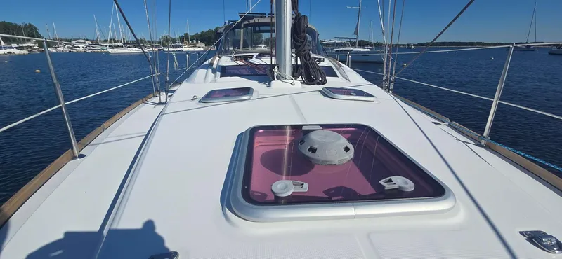 Sognare Yacht Photos Pics 2011 Beneteau Oceanis 40 sailboat deck with open hatch, docked in a marina.