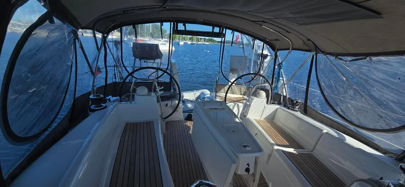 Sognare Yacht Photos Pics Beneteau Oceanis 40 cockpit view, 2011 model, featuring dual steering wheels and teak flooring.