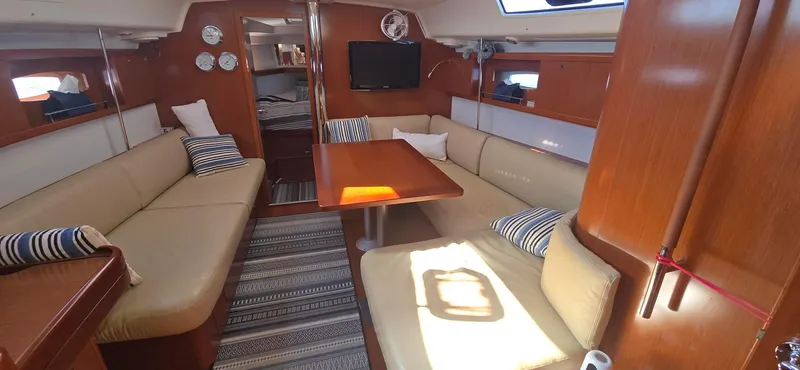 Sognare Yacht Photos Pics Interior of 2011 Beneteau Oceanis 40 sailboat with cozy seating and wooden finishes.
