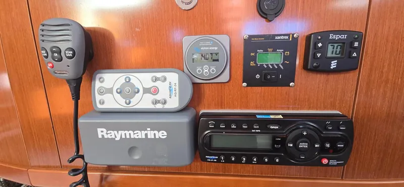 Sognare Yacht Photos Pics Control panel of a 2011 Beneteau Oceanis 40 yacht with navigation and communication equipment.