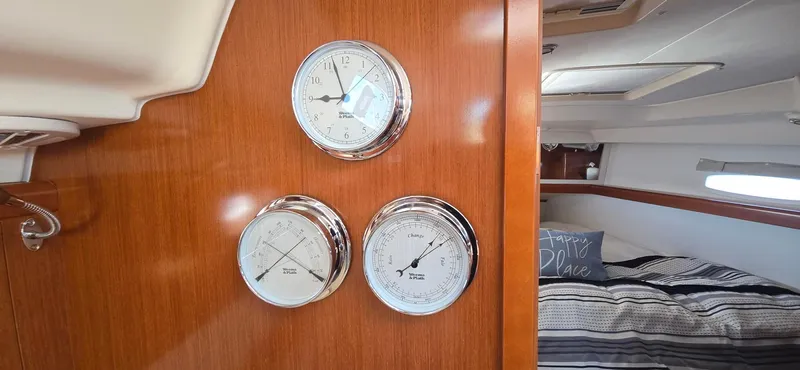 Sognare Yacht Photos Pics Interior of 2011 Beneteau Oceanis 40 yacht with clock, barometer, and cozy cabin.