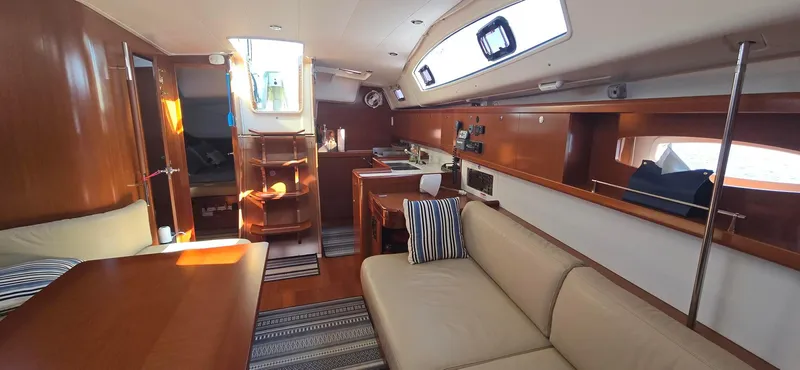 Sognare Yacht Photos Pics Interior of 2011 Beneteau Oceanis 40 yacht, featuring elegant wood finishes and comfortable seating.