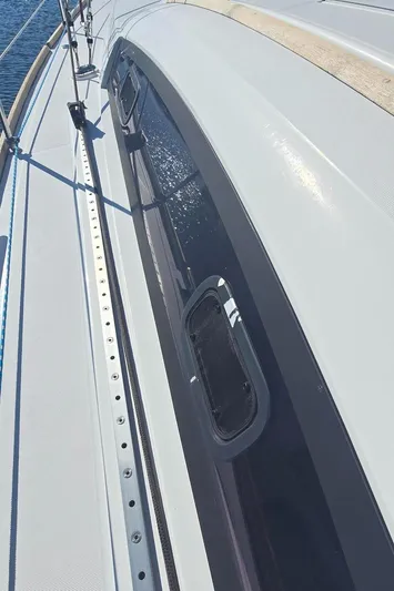 Sognare Yacht Photos Pics Beneteau Oceanis 40 sailboat deck, 2011 model, featuring sleek design and window details.