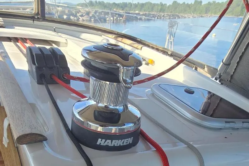 Sognare Yacht Photos Pics Winch on 2011 Beneteau Oceanis 40 sailboat deck with ropes and scenic water view.