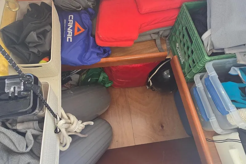 Sognare Yacht Photos Pics Storage area on a 2011 Beneteau Oceanis 40 sailboat with various equipment and supplies.