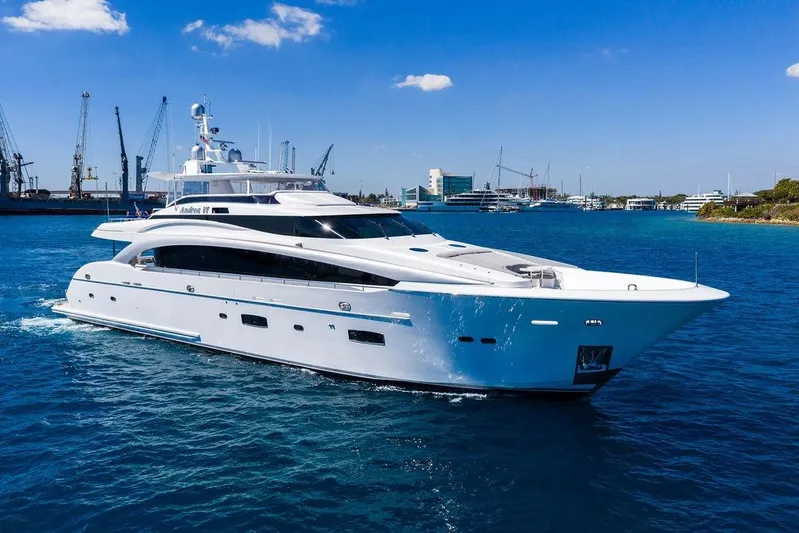  Yacht Photos Pics Luxurious 2014 Horizon RP 110 yacht cruising in a vibrant blue harbor.