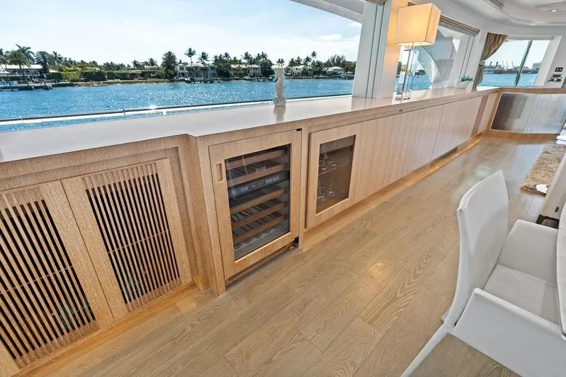  Yacht Photos Pics Luxurious interior of 2014 Horizon RP 110 yacht with elegant wood cabinetry and scenic water views.