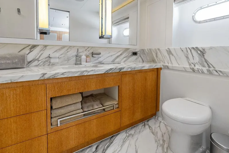  Yacht Photos Pics Luxurious yacht bathroom with marble countertops, wooden cabinetry, and modern fixtures, Horizon RP 110, 2014.