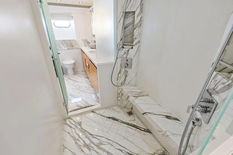  Yacht Photos Pics Luxurious marble bathroom in 2014 Horizon RP 110 yacht, featuring modern shower and toilet.