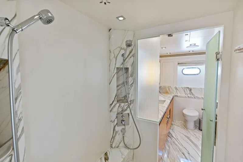 Yacht Photos Pics Luxurious bathroom in 2014 Horizon RP 110 yacht with marble accents and modern fixtures.