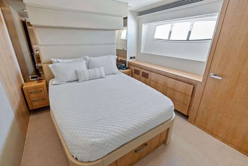  Yacht Photos Pics Luxurious bedroom interior on 2014 Horizon RP 110 yacht, featuring elegant wood finishes and modern design.