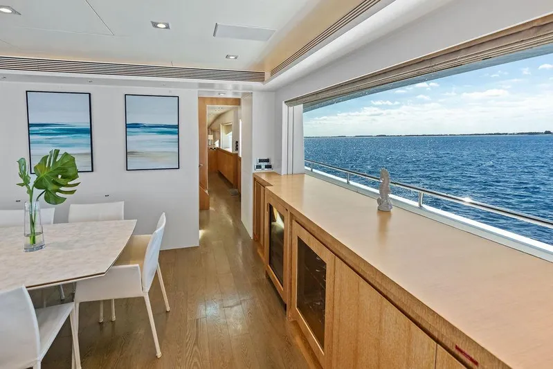  Yacht Photos Pics Luxurious Horizon RP 110 yacht interior with ocean view, modern dining area, and elegant decor.