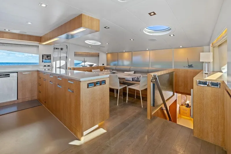  Yacht Photos Pics Luxurious interior of 2014 Horizon RP 110 yacht with modern kitchen and dining area.