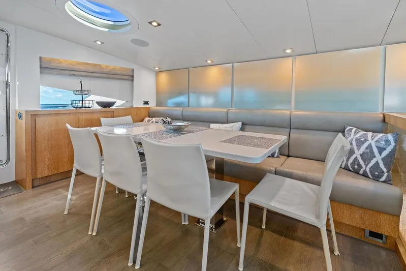  Yacht Photos Pics Luxurious dining area inside 2014 Horizon RP 110 yacht with modern decor and ocean view.