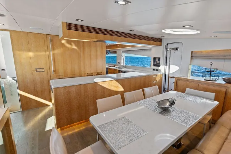 Yacht Photos Pics Luxurious interior of 2014 Horizon RP 110 yacht with modern dining area and ocean view.