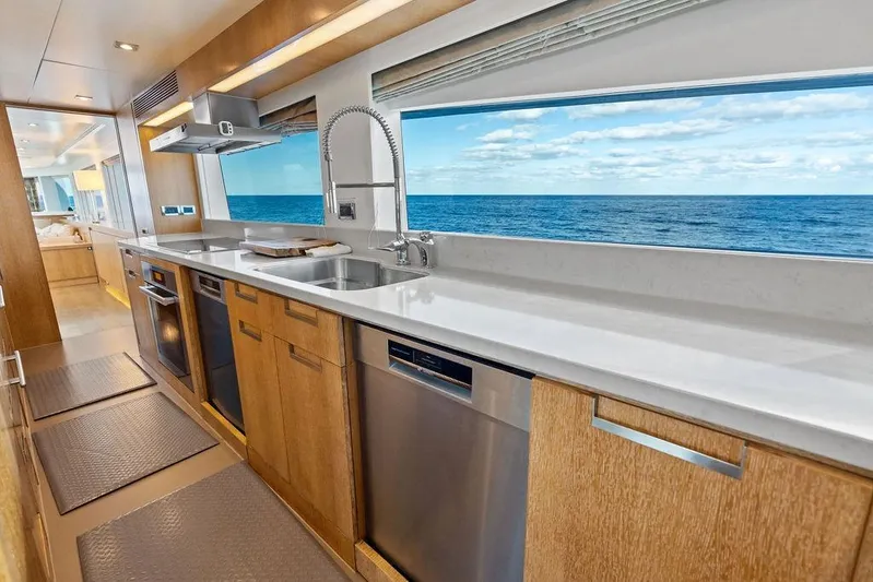 Yacht Photos Pics Luxurious Horizon RP 110 yacht kitchen with ocean view, modern appliances, and sleek design, 2014 model.