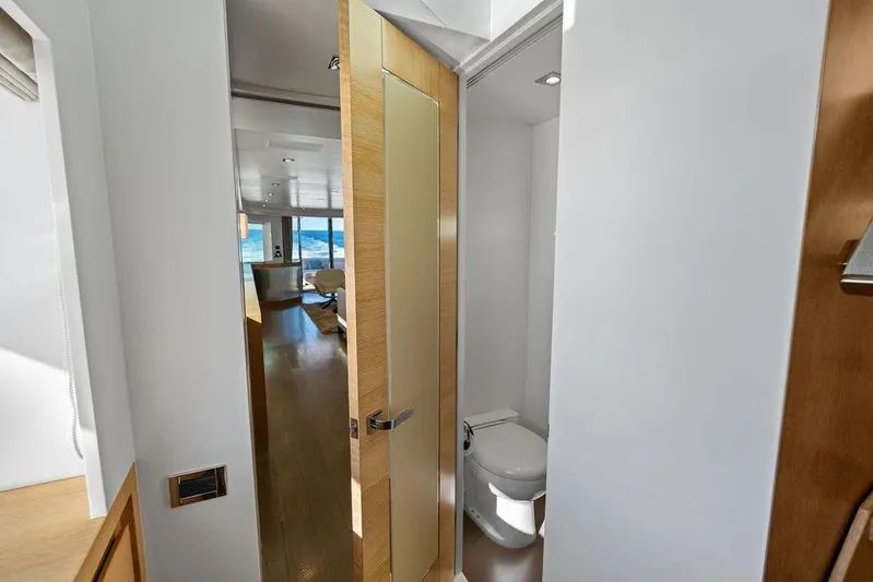  Yacht Photos Pics Modern yacht interior with bathroom, wooden door, and ocean view, Horizon RP 110, 2014 model.