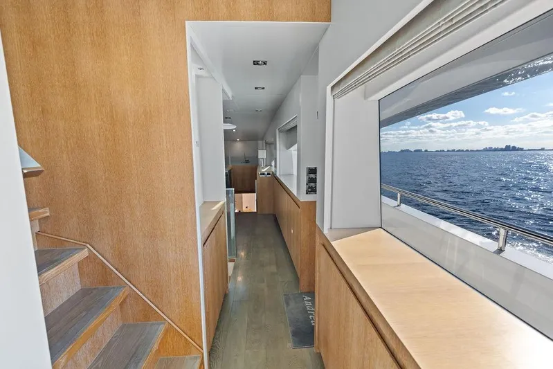  Yacht Photos Pics Interior of 2014 Horizon RP 110 yacht with ocean view through large window.