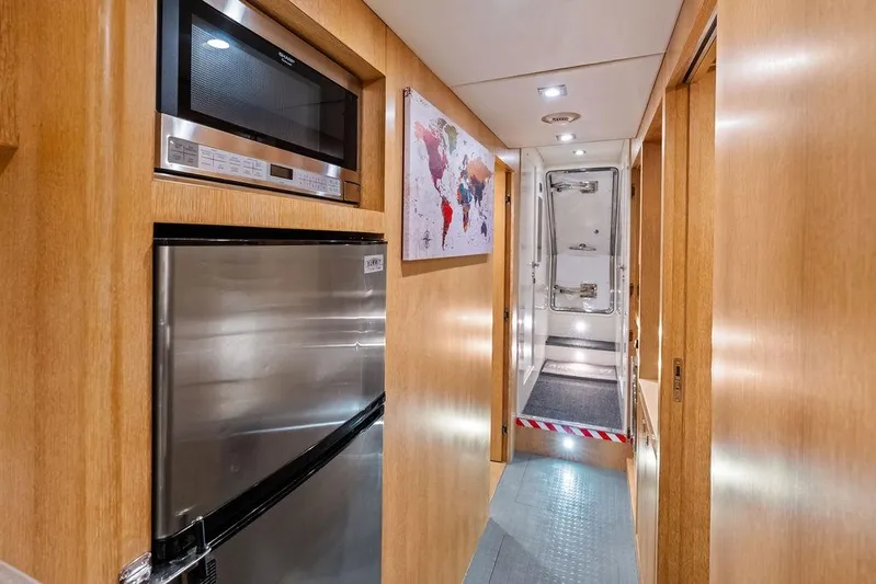  Yacht Photos Pics Hallway in 2014 Horizon RP 110 yacht with stainless steel appliances and world map artwork.