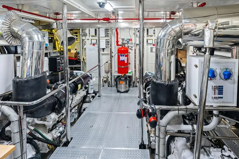  Yacht Photos Pics Engine room of 2014 Horizon RP 110 yacht with polished metal pipes and equipment.