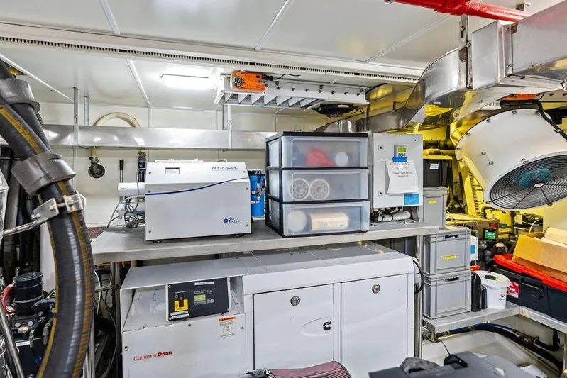  Yacht Photos Pics Engine room of 2014 Horizon RP 110 yacht with equipment and storage.