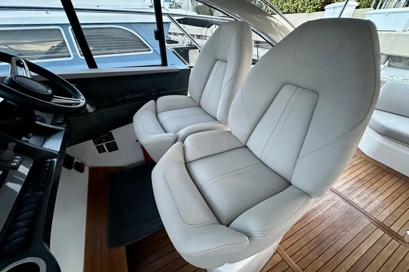 Bejul Yacht Photos Pics Luxurious interior of 2021 Princess V40 yacht with plush white seating.