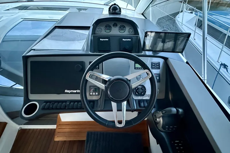 Bejul Yacht Photos Pics Steering console of 2021 Princess V40 yacht with Raymarine navigation system.