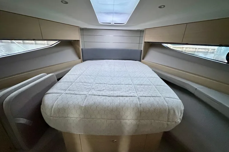 Bejul Yacht Photos Pics Luxurious interior of 2021 Princess V40 yacht with spacious bed and modern design.