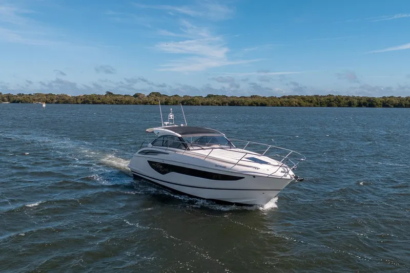 Bejul Yacht Photos Pics 2021 Princess V40 yacht cruising on a sunny day in open waters.