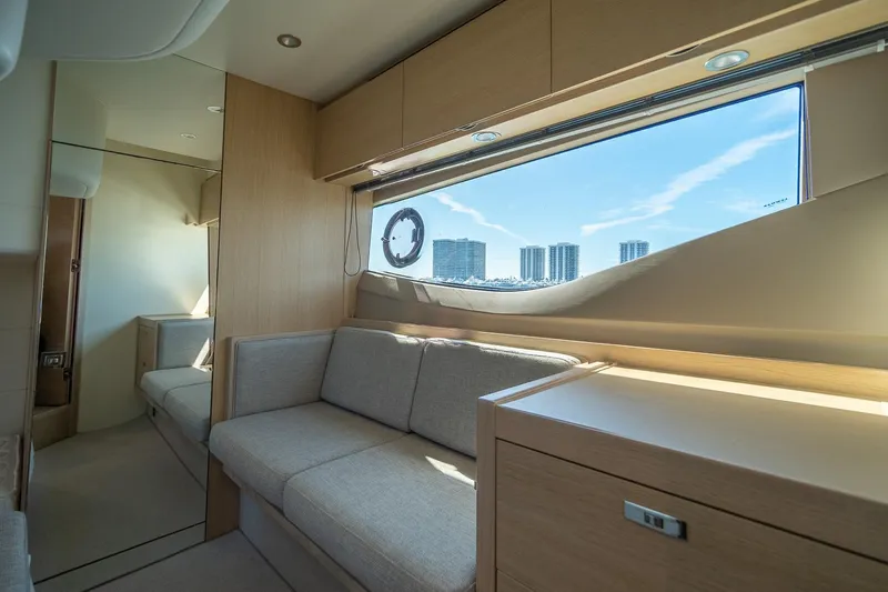 Bejul Yacht Photos Pics Luxurious interior of 2021 Princess V40 yacht with modern furnishings and large window view.